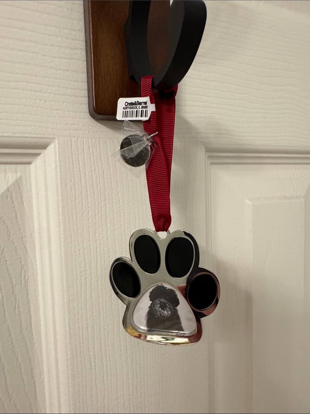 Crate&Barrel Silver Paw Ornament with Red Ribbon
